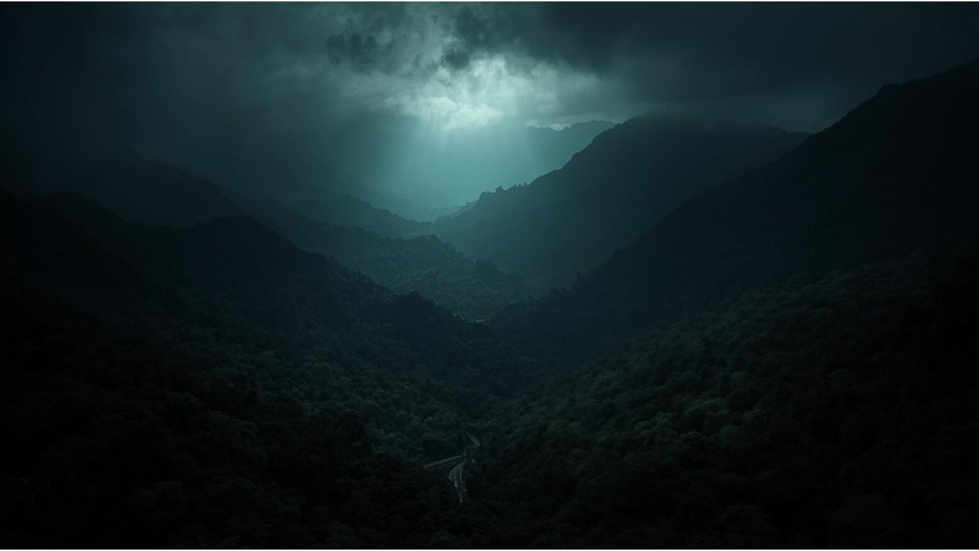 Valley opening beneath a break in the storm
